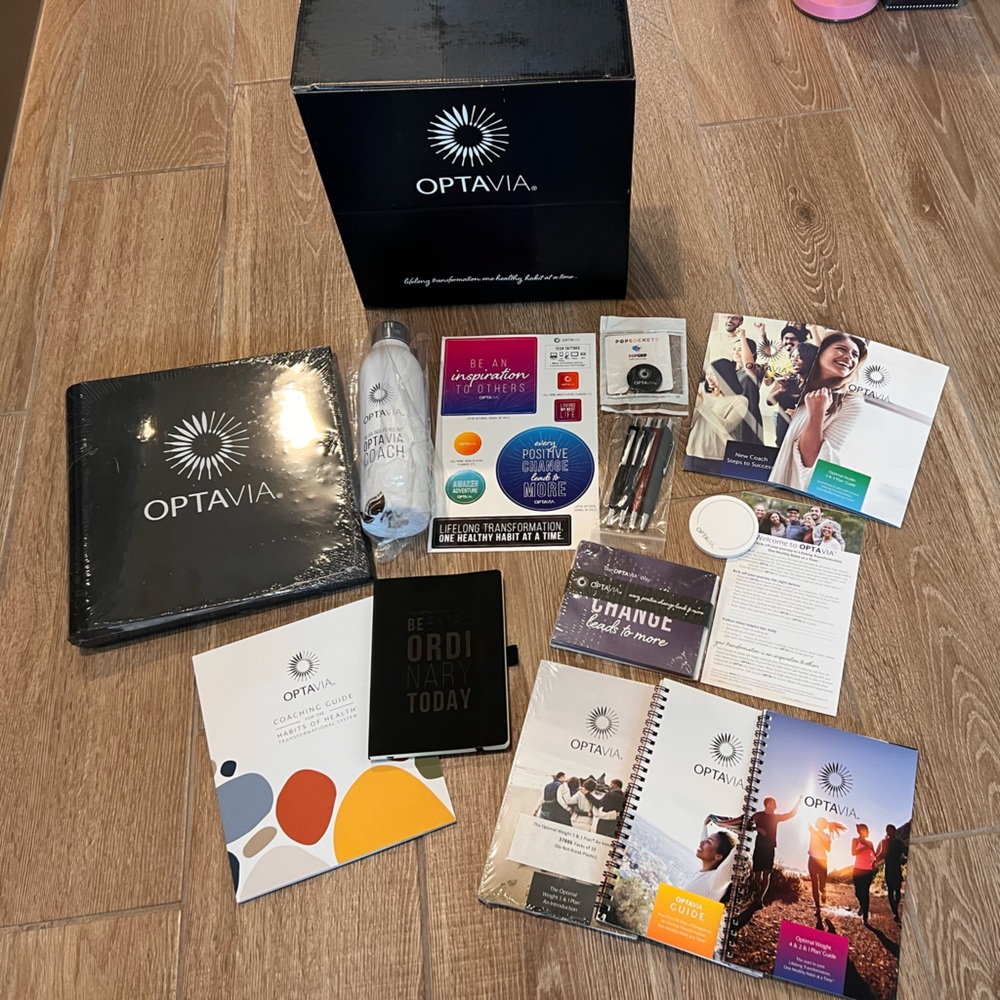 Optavia coaching kit, new, but opened. Some shrink wrap has been removed.